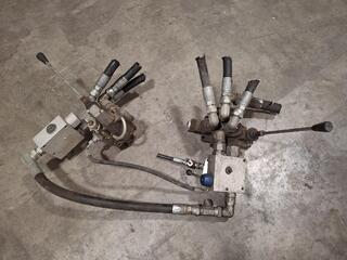 Hydraulic valve assemblies with hoses and levers