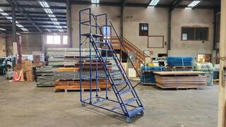 Blue mobile warehouse platform ladder